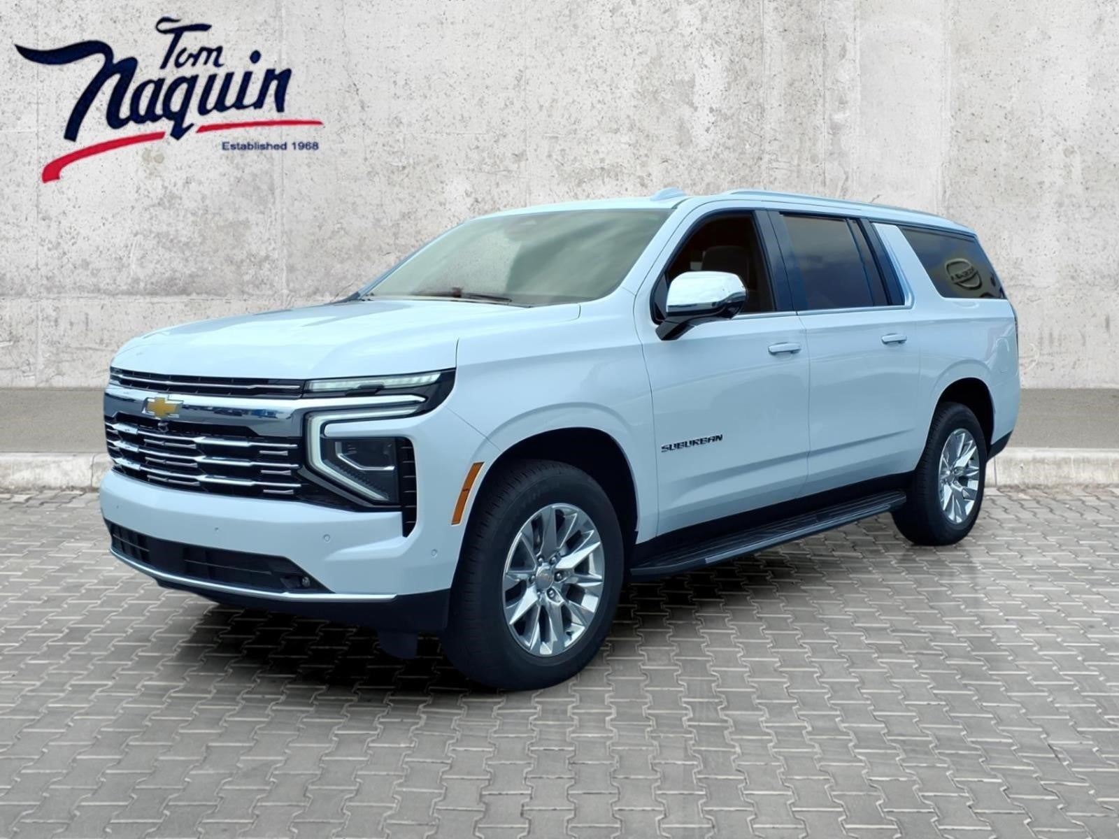 2026 Chevrolet Suburban Premier in Polar White Tricoat — front three-quarter view