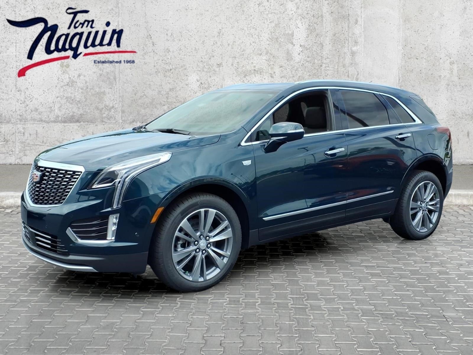 2026 Cadillac XT5 Premium Luxury in Emerald Lake Metallic — front three-quarter view