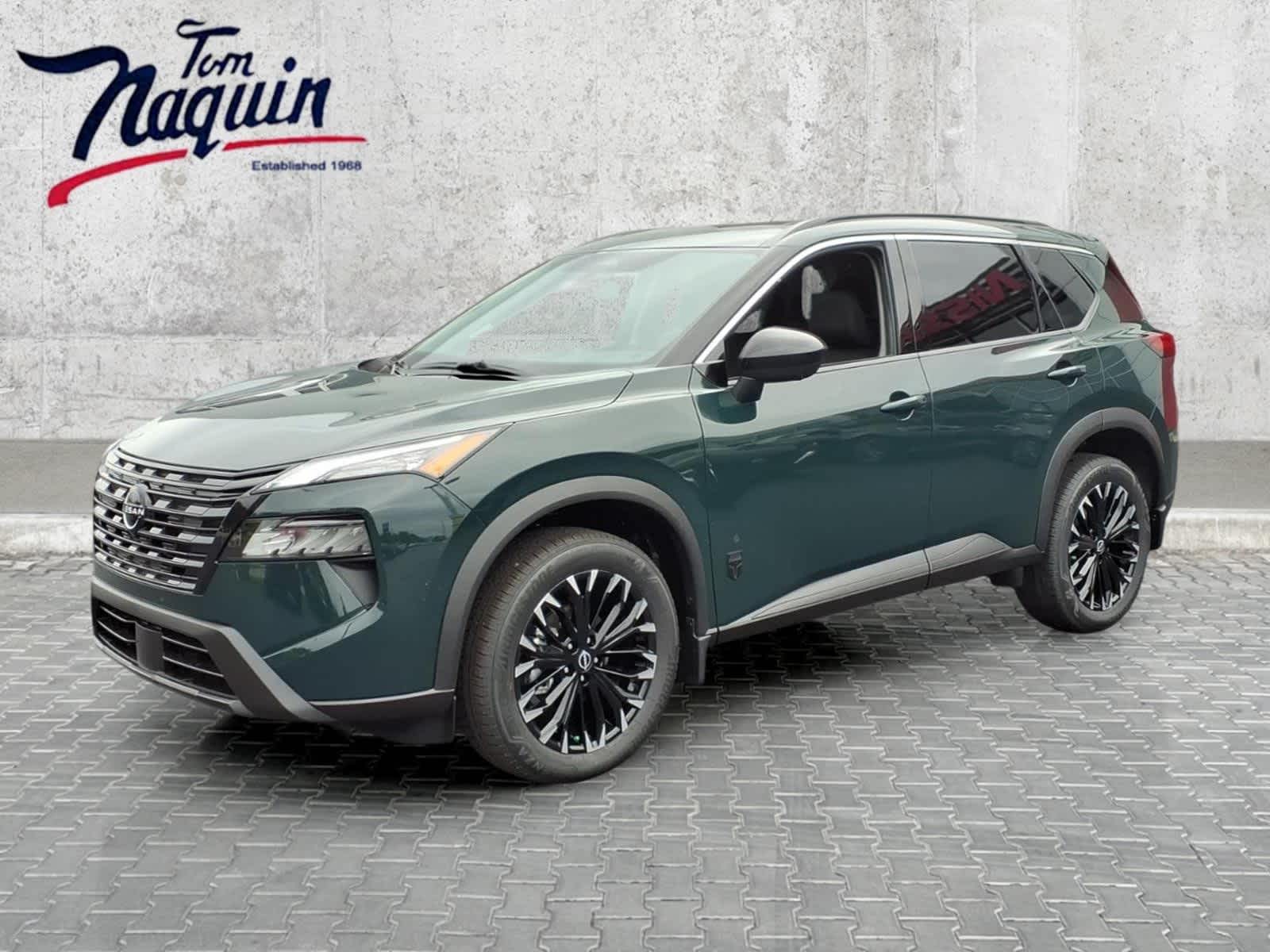 2026 Nissan Rogue Dark Armor in Obsidian Green — front three-quarter view