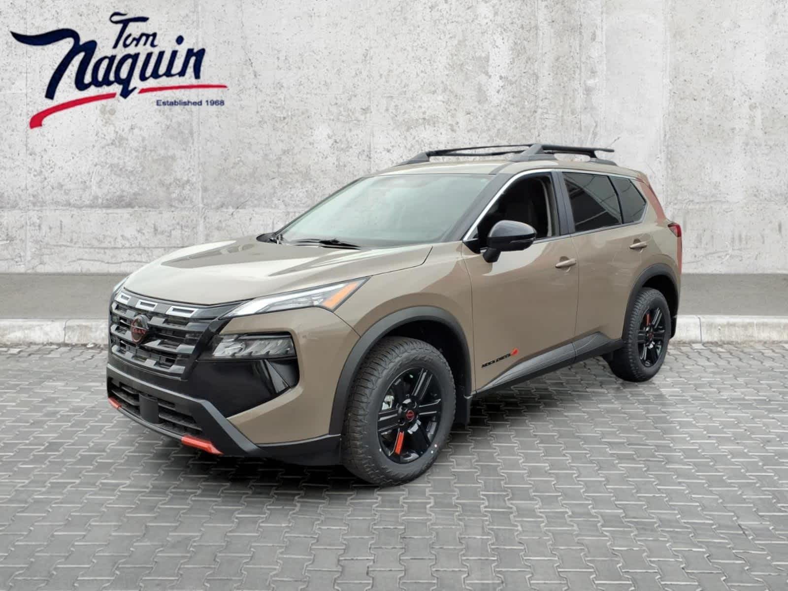 2026 Nissan Rogue Rock Creek in Baja Storm Metallic — front three-quarter view