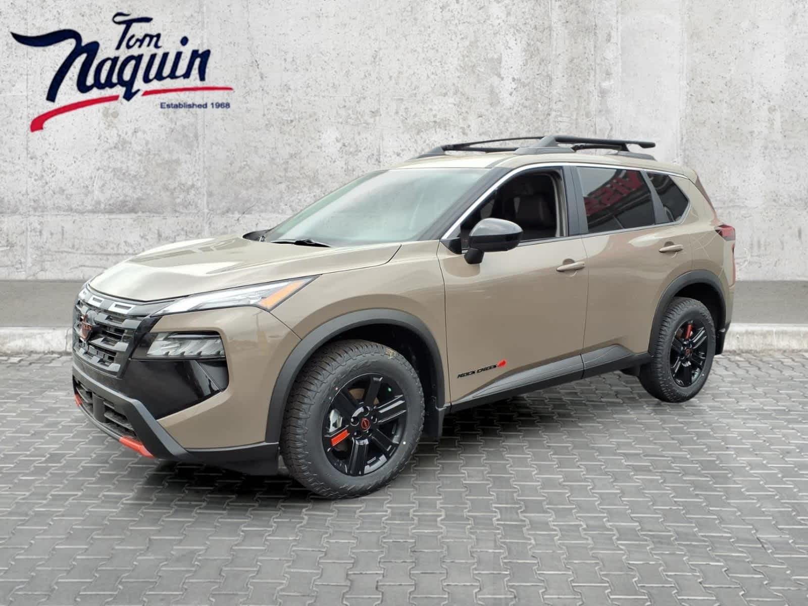 2026 Nissan Rogue Rock Creek in Baja Storm Metallic — front three-quarter view